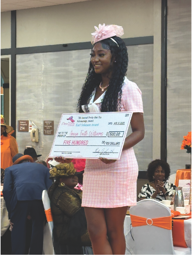 Aniya Faith Williams holding her $500 Earl Solomon Scholarship Award check